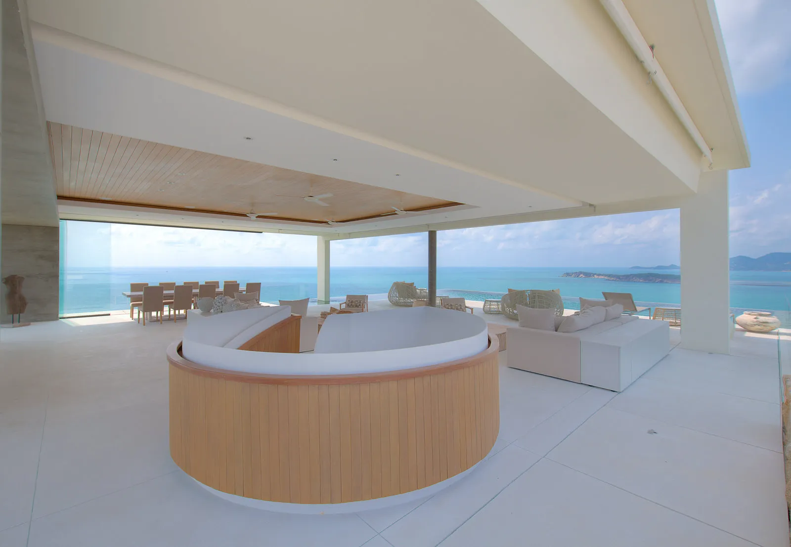 Curved outdoor bar and lounge on covered terrace with sea views, Koh Samui