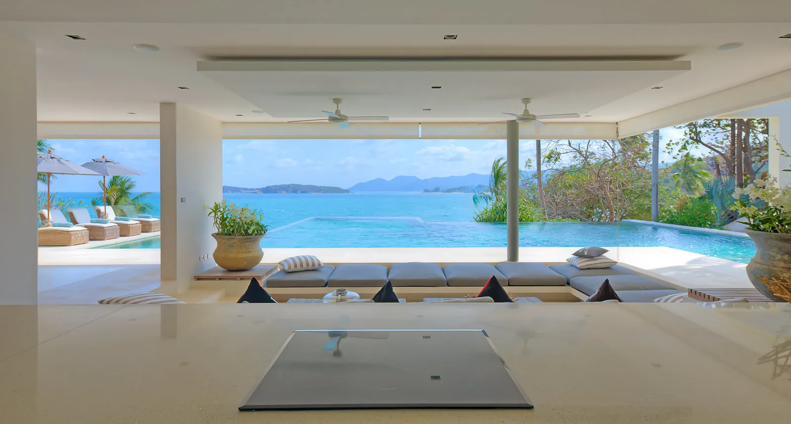 Kitchen island view through lounge to pool and bay, Koh Samui